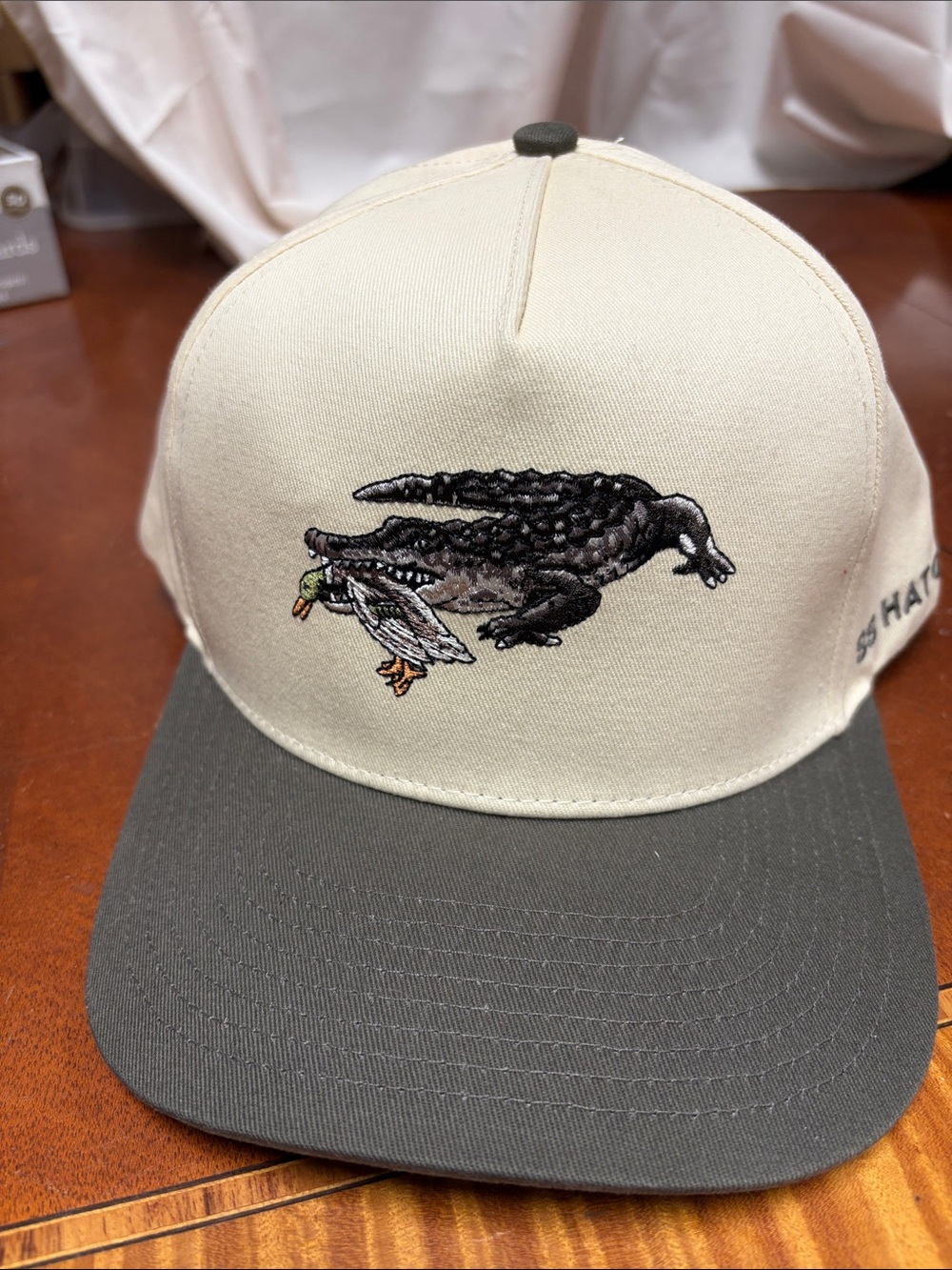 Cream and olive green Alligator Embroidered Cap from SS Hat Company